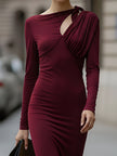 FJØRNA elegant long-sleeve draped cutout evening gown, a stylish maxi dress with flowing fabric and sophisticated design.