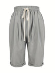 FJØRNA lightweight summer women's Capri pants with relaxed fit, drawstring waist, and breathable fabric, lying flat on a white background.