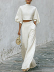 Cream textured lantern sleeve two-piece pants set by FJØRNA featuring stylish lantern sleeves and a coordinated matching design.