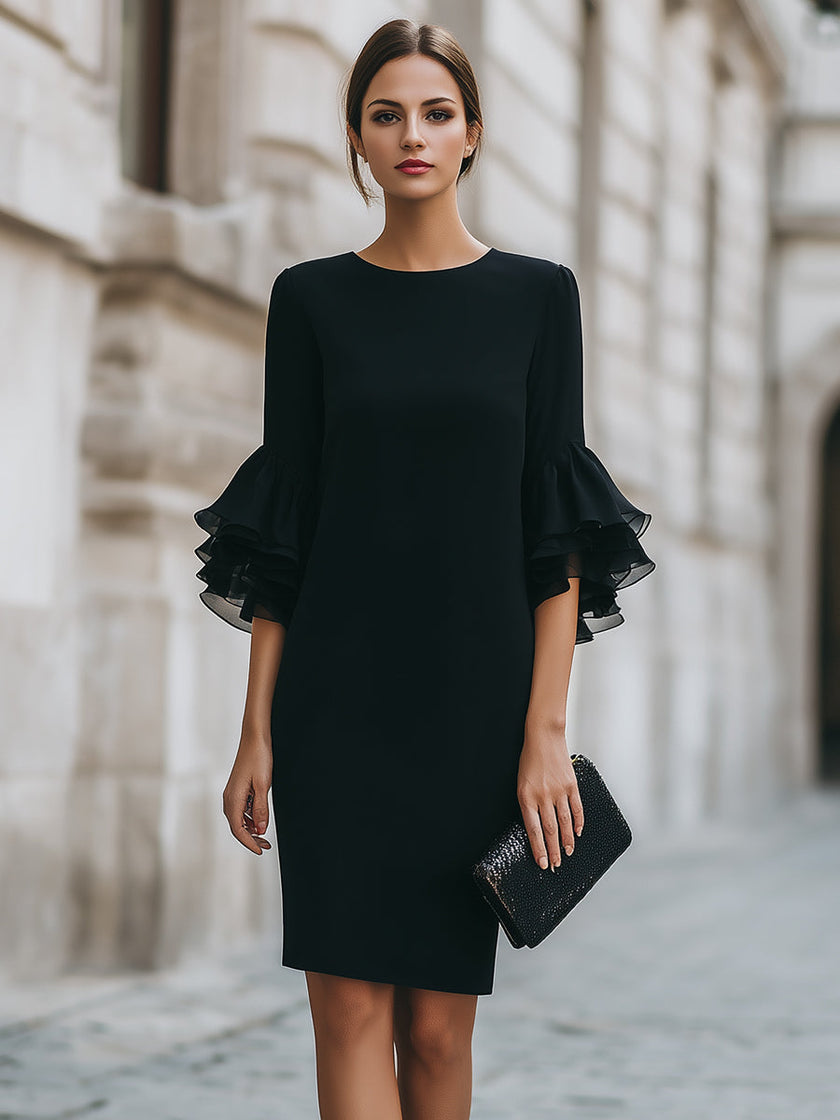 FJØRNA black dress with ruffled sheer sleeves, elegant evening dress with stylish detail and flowing silhouette.