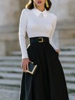 FJØRNA pleated A-line midi skirt with statement buckle belt, stylish women’s dress featuring flowy fabric and modern design.