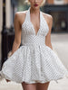 FJØRNA vintage halter polka dot bubble mini dress, perfect for weddings, featuring a stylish retro-inspired design and flared silhouette.