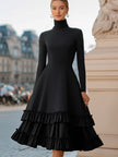 FJØRNA high-neck A-line tiered ruffle midi dress displayed with pleated fabric and ruffle details, elegant and flowy silhouette.
