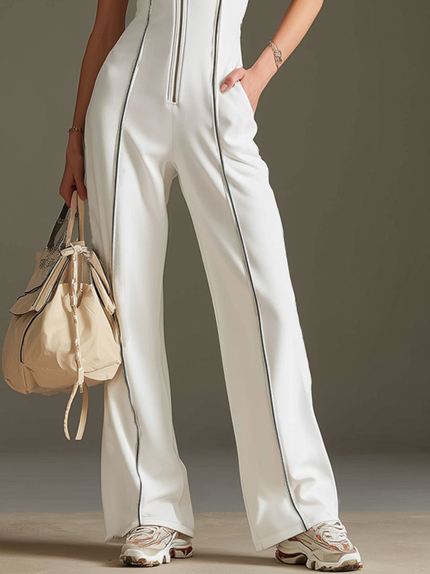 White cotton blend short sleeve wide-leg jumpsuit by FJØRNA, showing the relaxed fit and stylish design.
