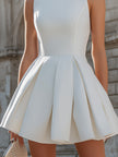 FJØRNA sleeveless structured mini dress with pleated design, fitted bodice, and short skirt, perfect for stylish summer wear.