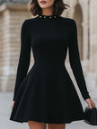 FJØRNA black studded neckline dress for women, elegant black dress with stylish studded detail on the neckline.
