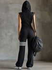 Black striped sleeveless hooded jumpsuit by FJØRNA, featuring a fitted design with a hood and bold stripe pattern.