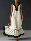 FJØRNA A-line maxi dress with contrast color pleats, ruffle trim, split joint, and V-neck design in a loose, elegant style.