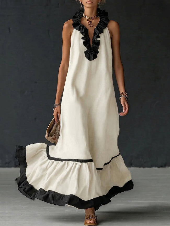 FJØRNA A-line maxi dress with contrast color pleats, ruffle trim, split joint, and V-neck design in a loose, elegant style.