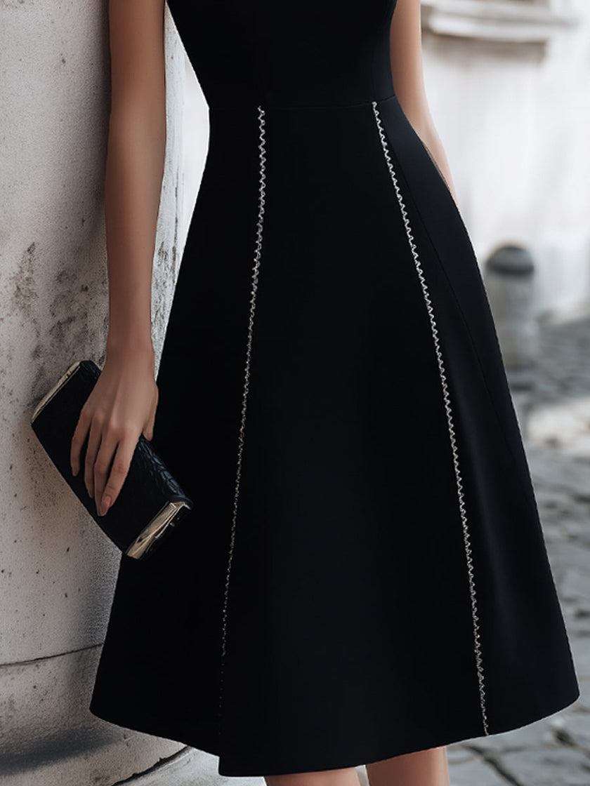 FJØRNA sleeveless A-line midi dress with chain-trim seams, stylish and elegant, displayed on a neutral background.