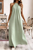 FJØRNA solid color loose halter neck backless casual maxi dress, perfect for weddings and casual occasions, shown in a natural pose.