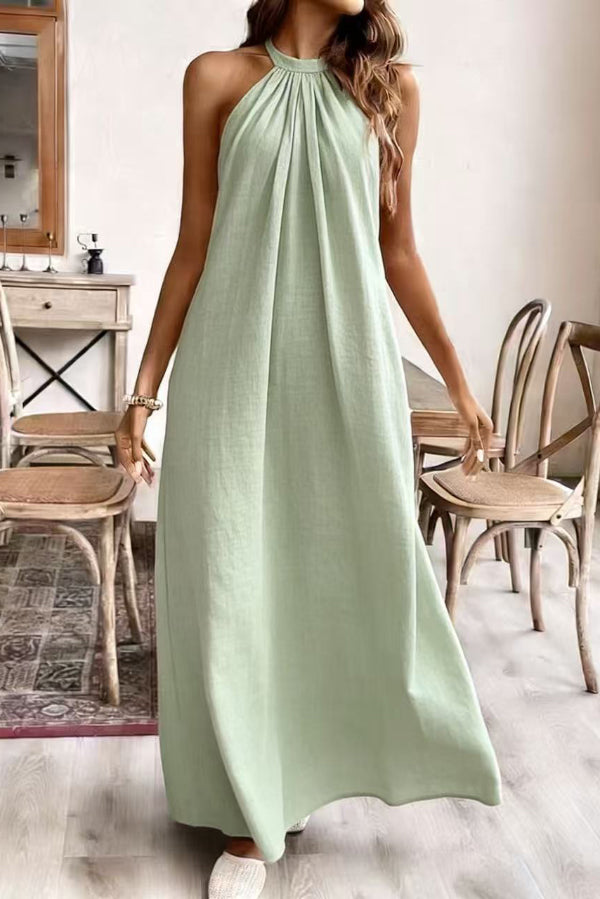 FJØRNA solid color loose halter neck backless casual maxi dress, perfect for weddings and casual occasions, shown in a natural pose.