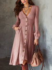 FJØRNA retro V-neck mohair knitted midi dress with button details and pockets, showcasing a stylish and cozy design.