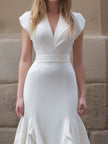 FJØRNA white midi gown with ruffled hem, structured V-neck bodice, perfect for elegant occasions, full-length dress for women