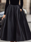 Elegant black velvet and satin midi dress for women by FJØRNA, featuring a stylish and sophisticated design.