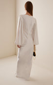 FJØRNA Vivir balloon-sleeve rose-detailed hammered satin maxi dress, elegant long dress with flowing silhouette and floral accents.