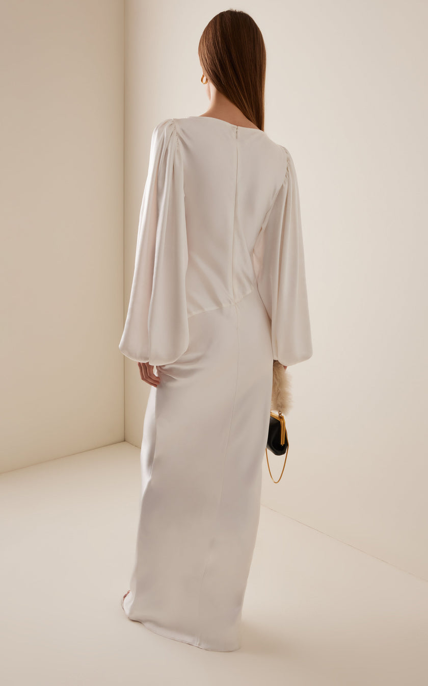 FJØRNA Vivir balloon-sleeve rose-detailed hammered satin maxi dress, elegant long dress with flowing silhouette and floral accents.