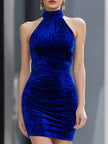 Royal blue velvet halter bodycon mini dress by FJØRNA, featuring a fitted silhouette and elegant halter neckline.