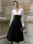 FJØRNA contrast bodice A-line midi dress with sheer sleeves, stylish and elegant for women, displayed on a hanger.