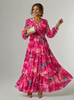 Elegant floral wrap dress for women by FJØRNA, showcasing a stylish, fitted design with a wrap neckline and vibrant floral pattern.