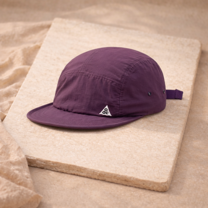Men's FJØRNA hat featuring a classic cap design with a curved brim and adjustable strap, made of durable fabric.
