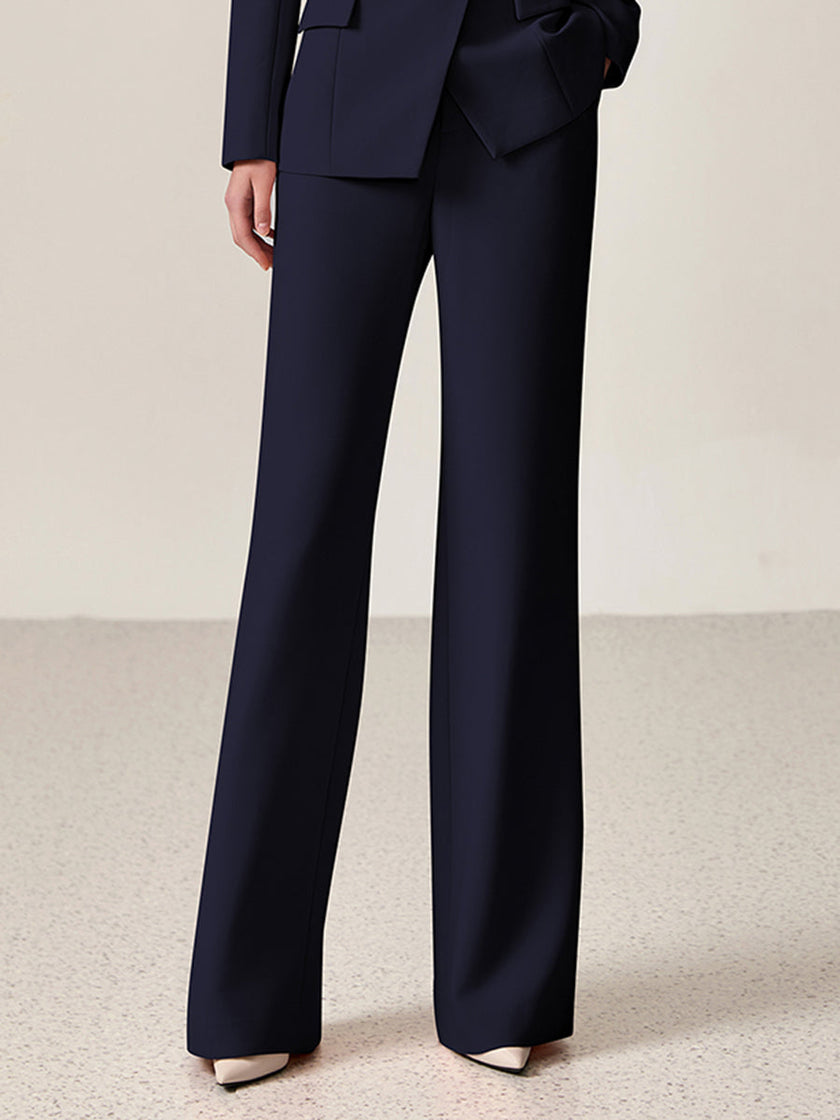 Navy lapel double-breasted two-piece suit set by FJØRNA, featuring a tailored blazer and matching trousers on a hanger.