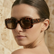 FJØRNA retro rectangular unisex sunglasses with dark lenses and thick black frames, stylish accessory for women and men