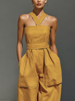 FJØRNA mustard linen-blend women's jumpsuit with crisscross neckline, relaxed fit, wide-leg pants, casual and stylish.