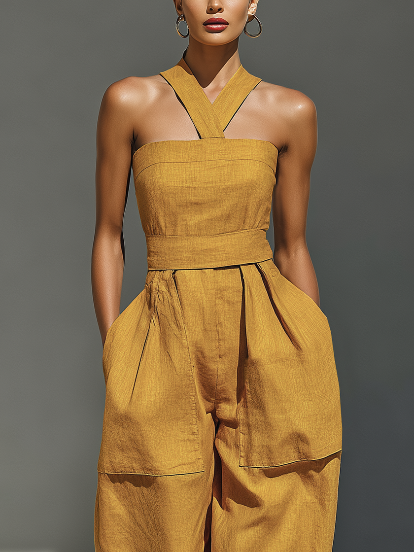FJØRNA mustard linen-blend women's jumpsuit with crisscross neckline, relaxed fit, wide-leg pants, casual and stylish.
