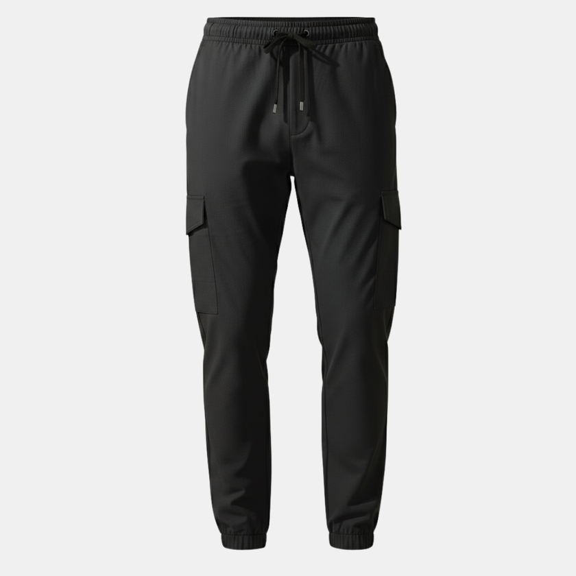 Men's FJØRNA cargo trousers with drawstring, relaxed fit, and multiple pockets, shown in a casual stance.