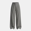 Women’s high waisted tailored wide-leg trousers by FJØRNA, showcasing the stylish fit and smooth fabric in a neutral color.