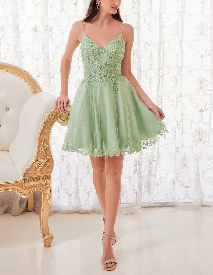 Mint green tulle cocktail dress for women by FJØRNA, featuring a fitted bodice and flowing skirt for elegant occasions.
