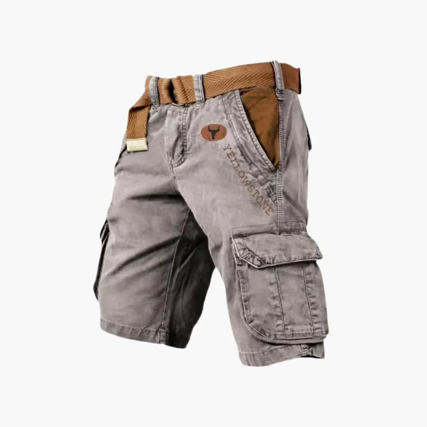 Men's FJØRNA cargo shorts with multiple functional pockets and ample storage, shown on a model with casual outdoor setting.