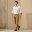 Men's linen blend straight leg trousers by FJØRNA with drawstring waist and relaxed fit, shown on a model.