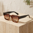 Vintage rectangular sunglasses by FJØRNA, unisex accessories for women, featuring classic style and dark tinted lenses.