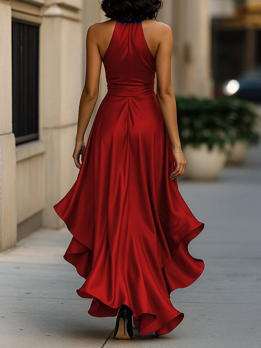 FJØRNA Midnight Elegance satin halter gown with ruffle details, flowing fabric, and a sophisticated evening dress style.
