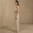 FJØRNA women's high waist wide leg pleated trousers, stylish and comfortable pants with a relaxed fit and modern design.