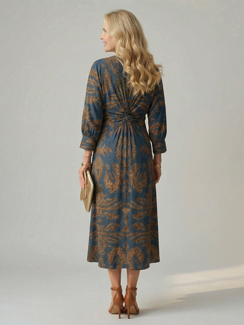 FJØRNA women's summer midi dress with long sleeves and wrap design, lightweight and stylish for warm weather wear.
