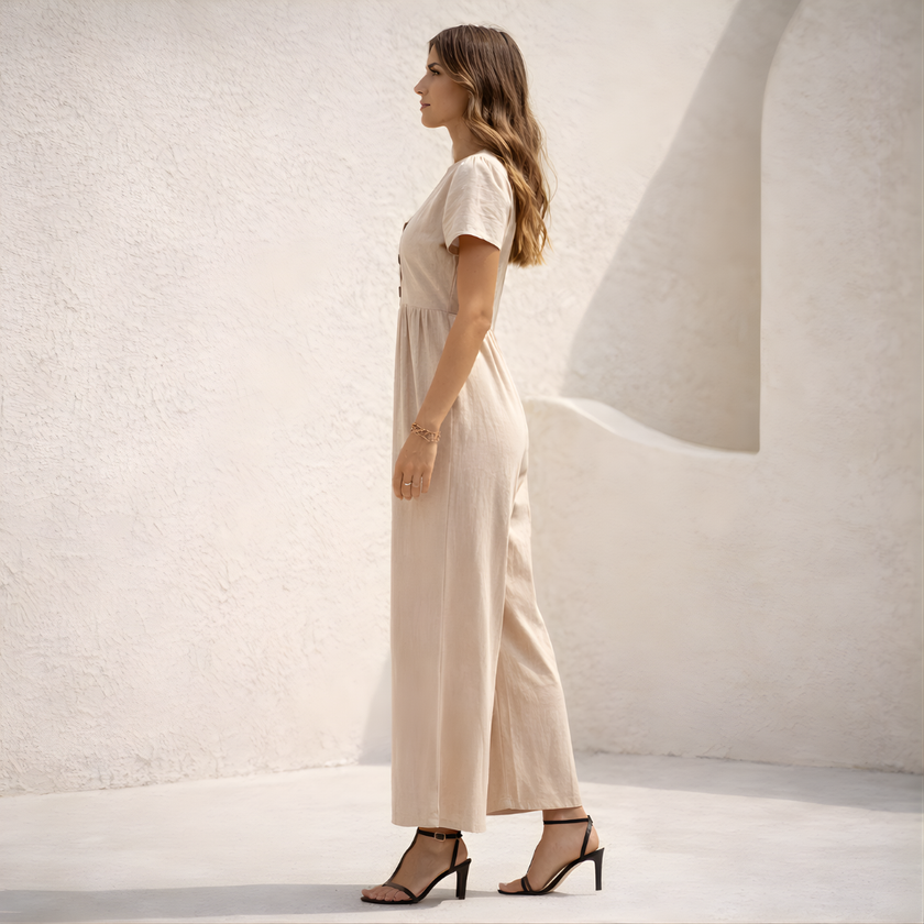 Women’s linen blend suit set by FJØRNA featuring a stylish wide-leg design and tailored fit, shown in a neutral color.
