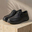 Red leather men's orthopedic walking shoes by FJØRNA, featuring supportive design and casual style.