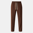Men's wide-leg FJØRNA jogger pants with drawstring waist, casual comfortable style, shown in a relaxed fit.