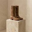 Tan leather men's knee-high boots with block heels, stylish shoes by FJØRNA, featuring a smooth leather finish and classic design.