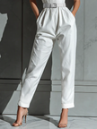 Ivory cotton-linen women's jumpsuit with V-neck, cinched waist, and wide-leg pants by FJØRNA.