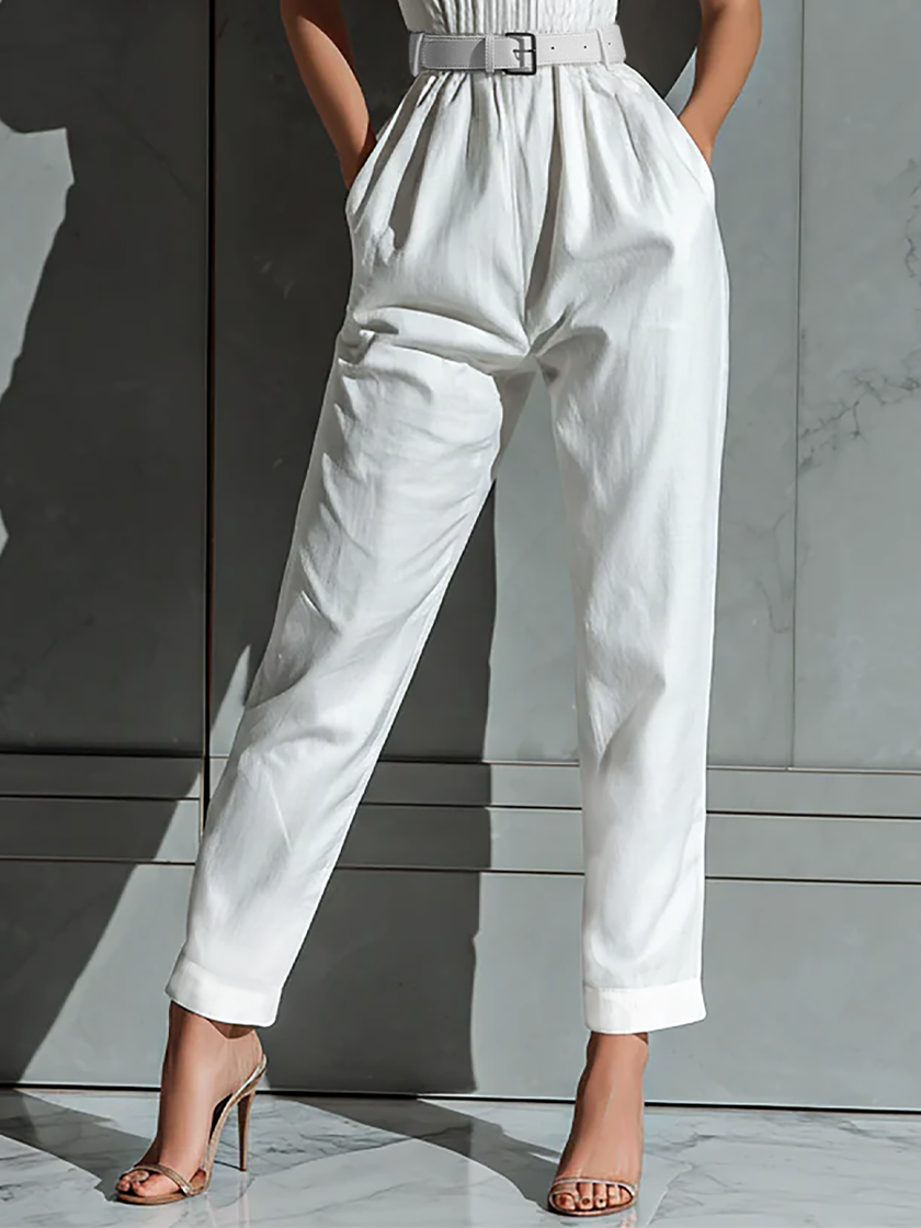 Ivory cotton-linen women's jumpsuit with V-neck, cinched waist, and wide-leg pants by FJØRNA.