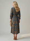 FJØRNA women's summer midi dress with long sleeves, wrap design, flowy fabric, and feminine style, perfect for warm weather.