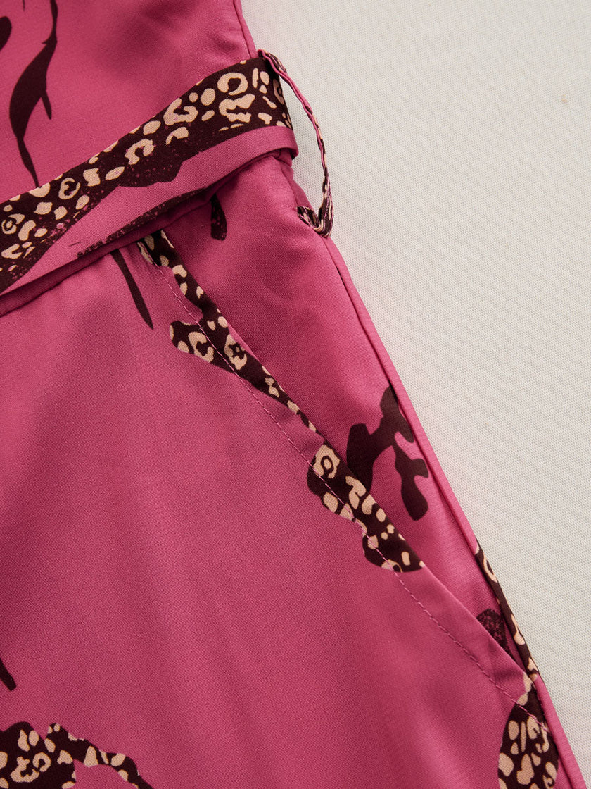 Rose red leopard print chiffon jumpsuit with long sleeves and a relaxed fit, designed by FJØRNA.