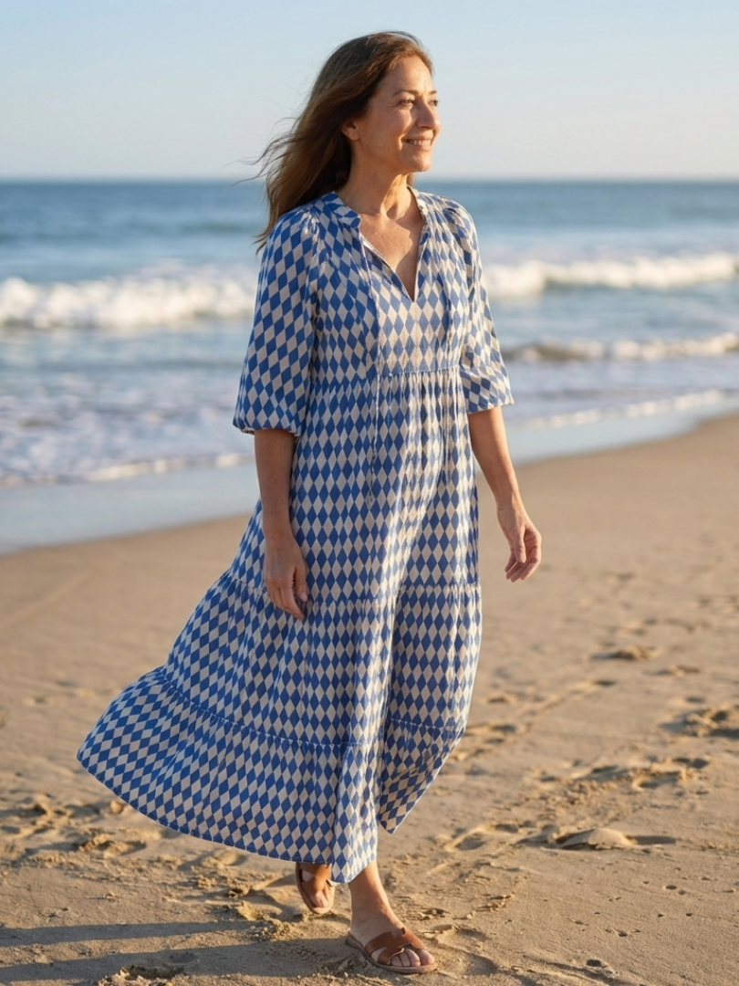 FJØRNA women's summer midi dress with a colorful print and wrap design, perfect for warm-weather casual wear.