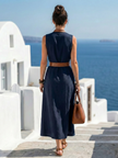 FJØRNA elegant sleeveless wrap midi dress for women, showcasing a flattering silhouette and stylish design.