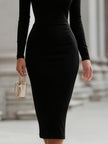 FJØRNA black off-the-shoulder long-sleeve sheath dress for women, fitted style with elegant neckline and sleek silhouette.