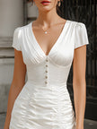 FJØRNA satin V-neck mini dress with ruched bodice and ruffle hem, stylish and elegant for special occasions.